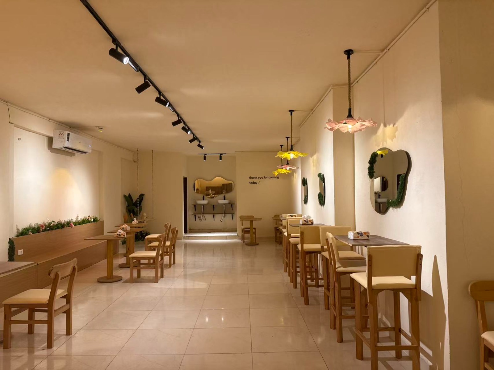 Inside WeDrink — bean bags, warm lights, plants
