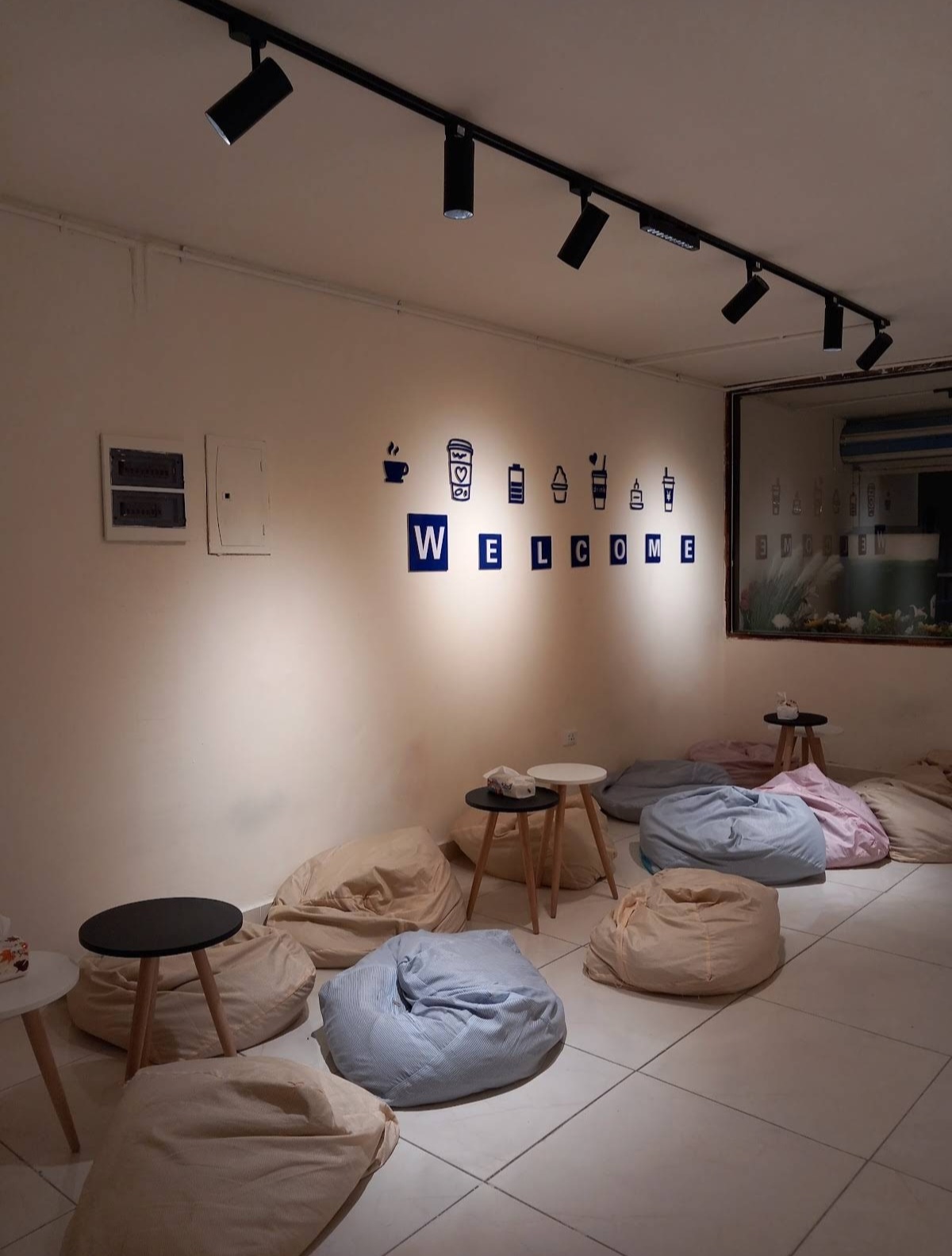 Cozy bean bag lounge under track lighting